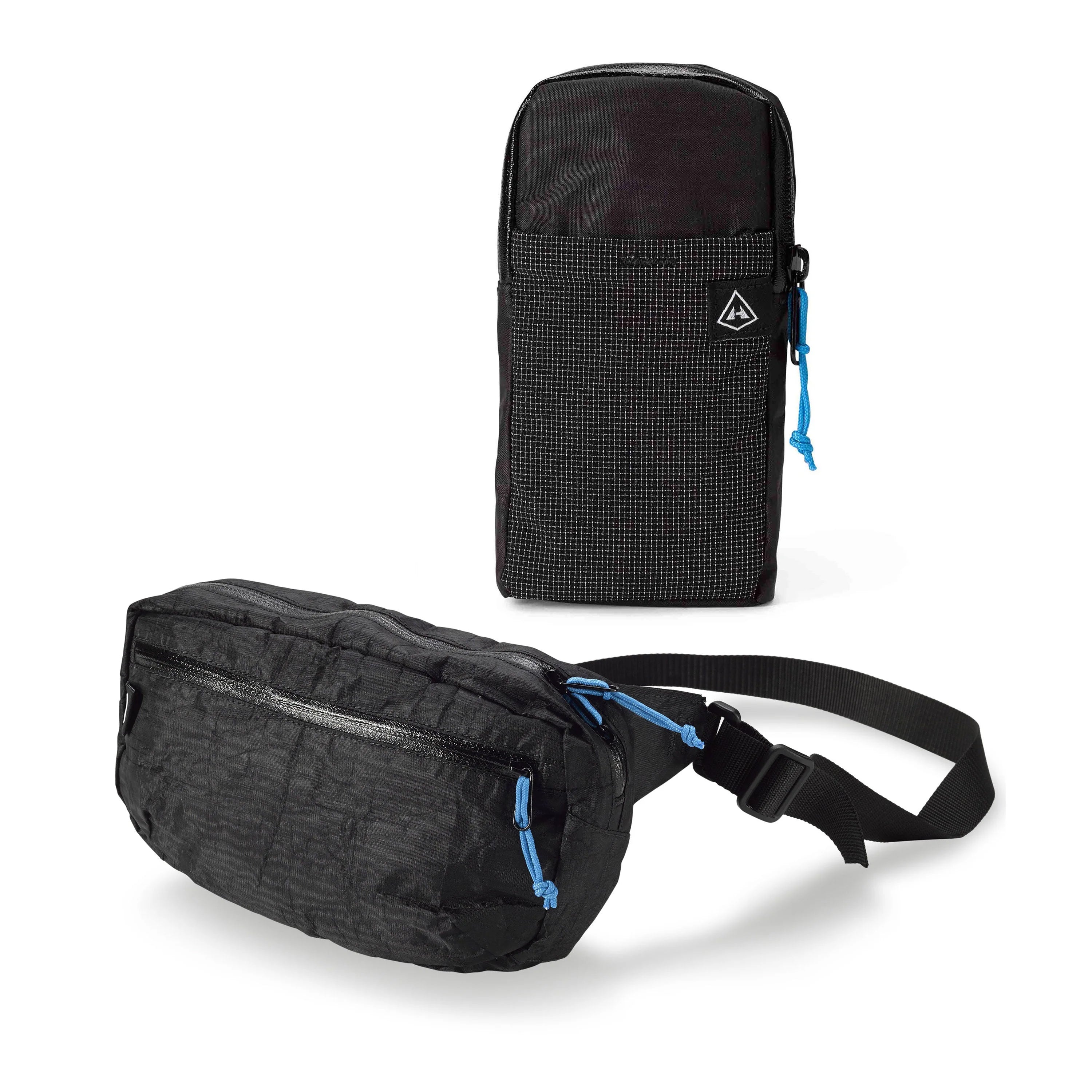 Studio image of a Hyperlite Mountain Gear Versa and Shoulder Pocket in Black, both included in the Accessory Bundle