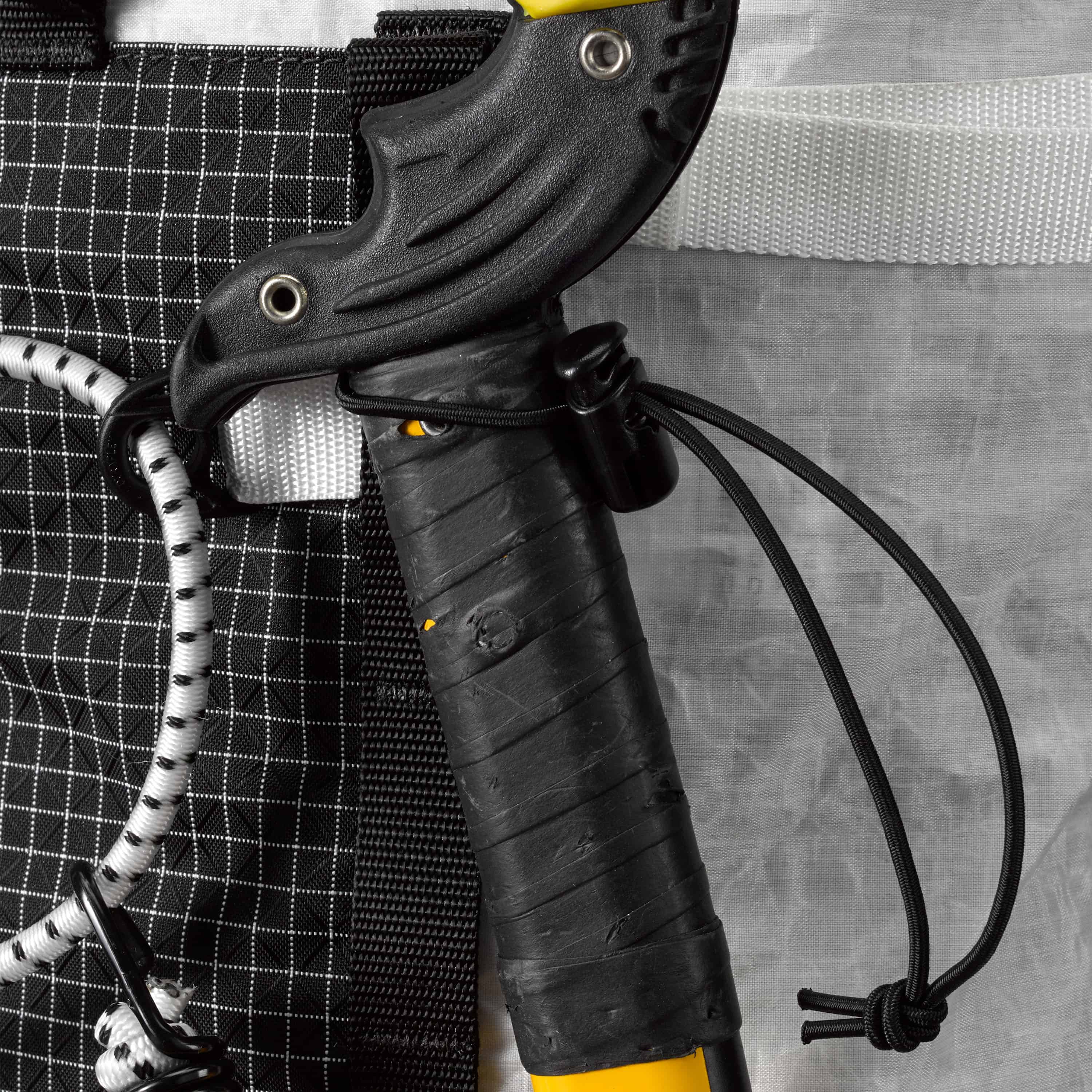 Detail shot of the bungees on Hyperlite Mountain Gear's Ice Pack 70 Pack in White