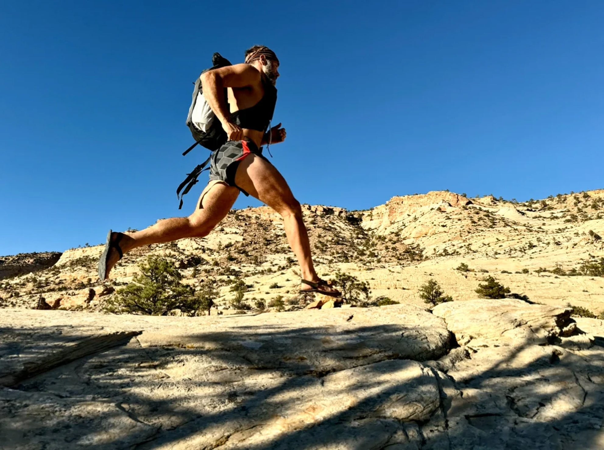a trail runner with Hyperlite pack in action