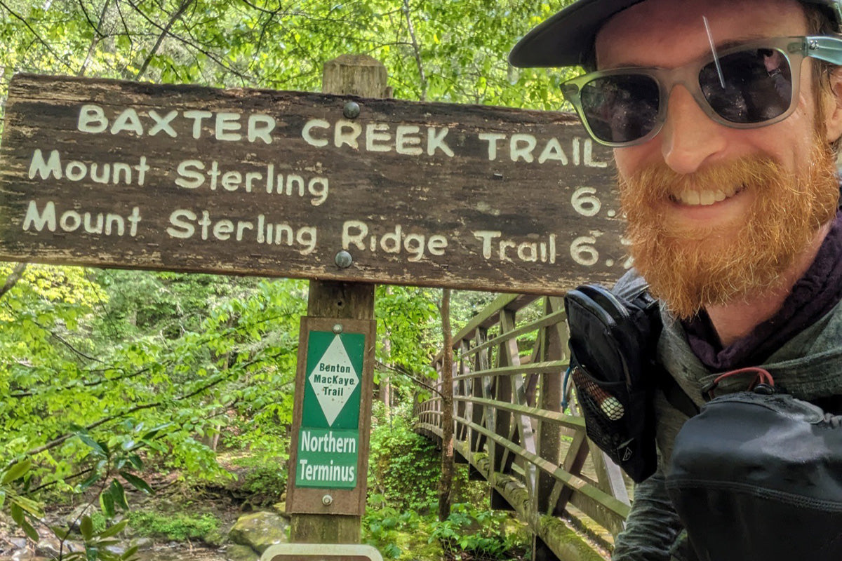 in front of the Baxter Creek Trail sign