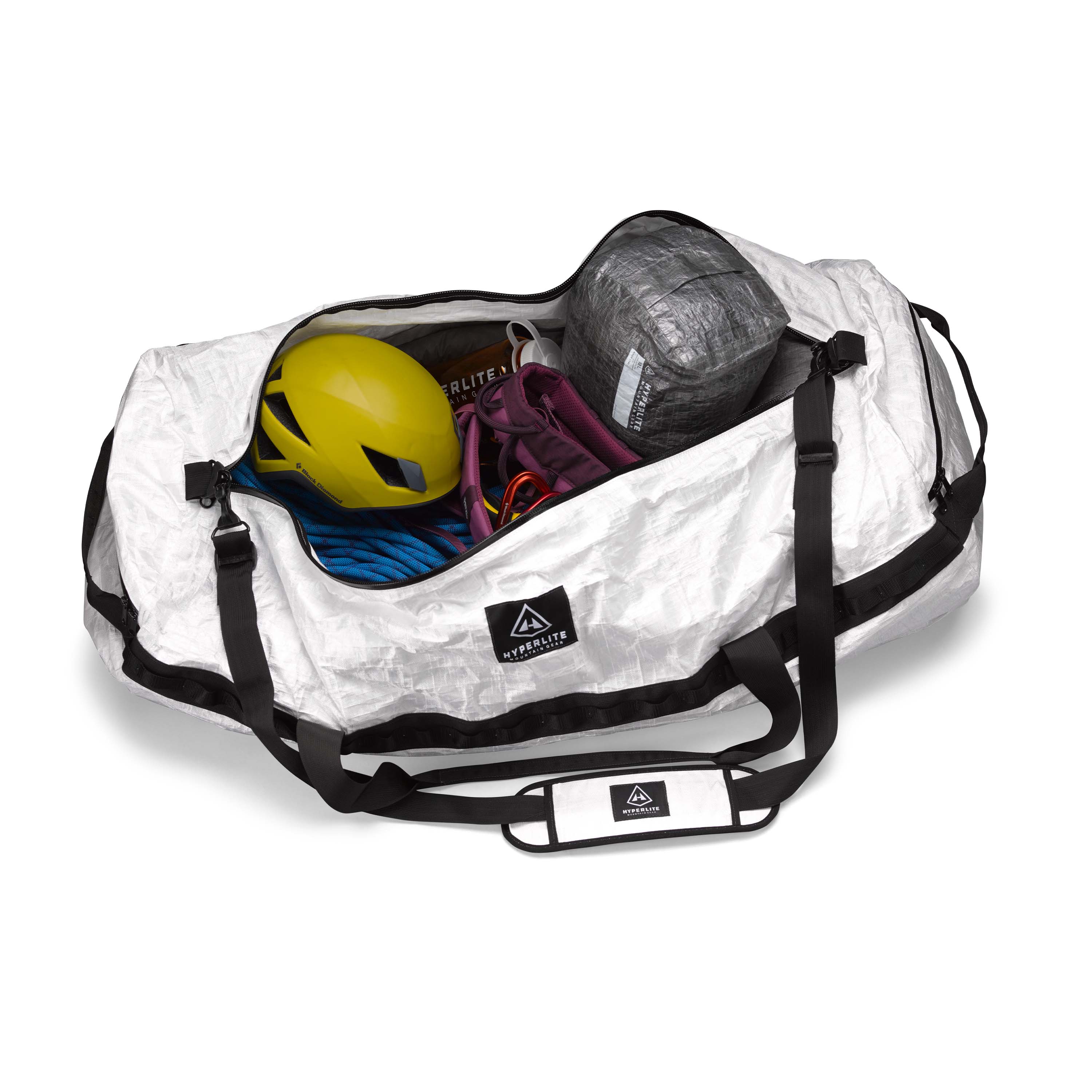 Overhead view of the Hyperlite Mountain Gear 140L Approach Duffel open and filled with climbing gear