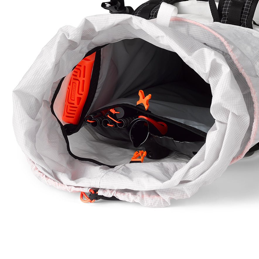 Inside view of the Hyperlite Mountain Gear Crux 40 showing the internal sleeve with one main and two side avalanche tool pockets