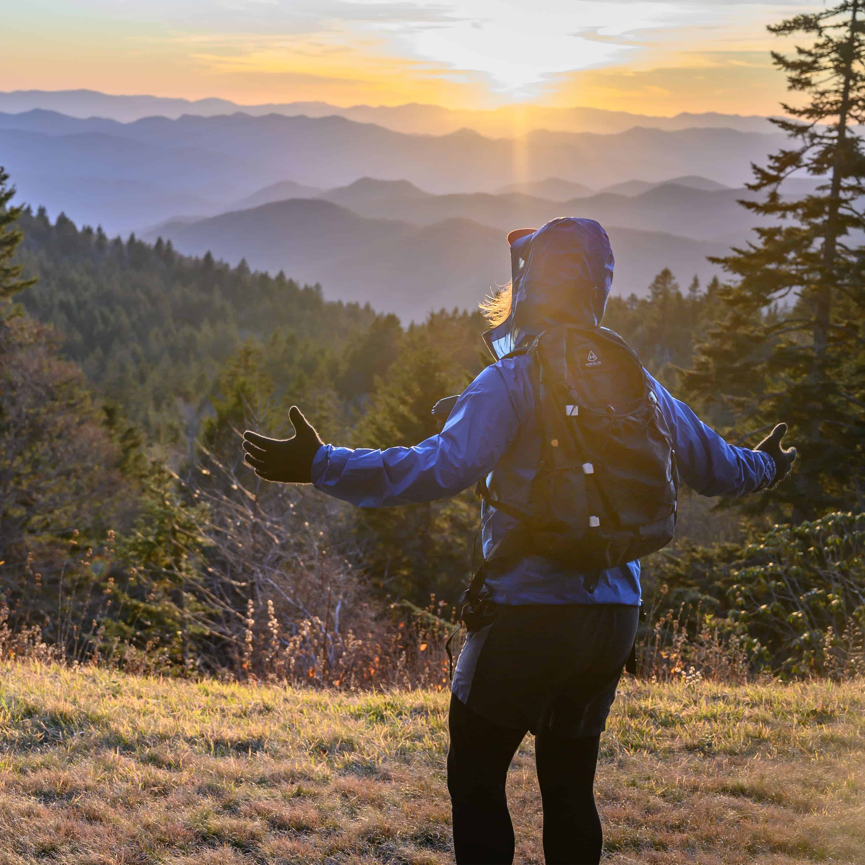 Back view of hiker wearing Hyperlite Mountain Gear's Daybreak 17 Pack in Black 