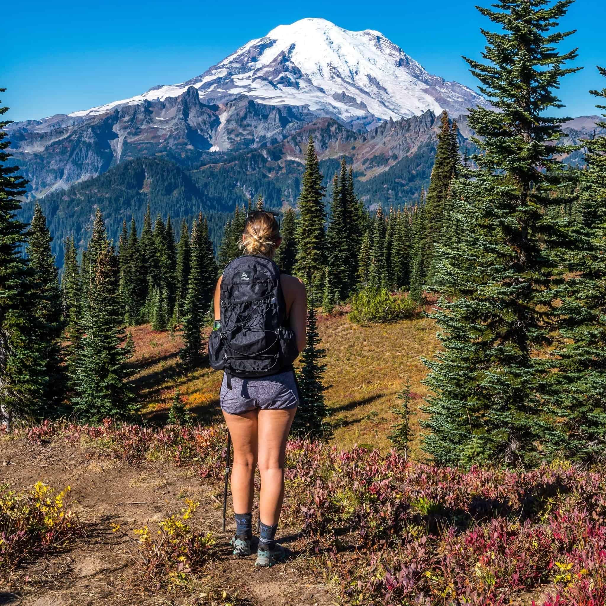 Back view of Hyperlite Mountain Gear's Daybreak 17 Pack in Black on hiker in the mountains