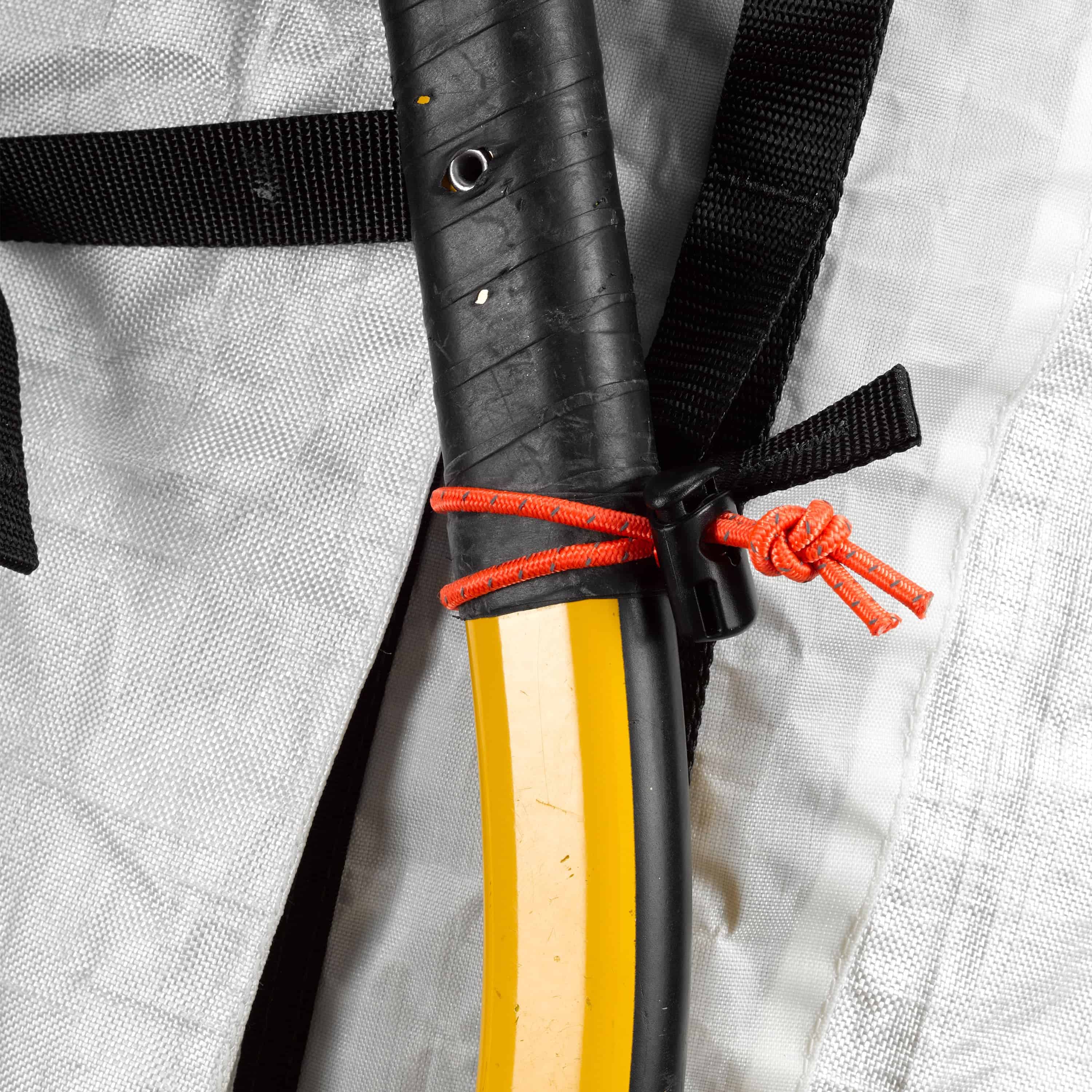 Close up shot of the reflective bungees with quick-release pull tabs on Hyperlite Mountain Gear's Prism 40 Pack in White