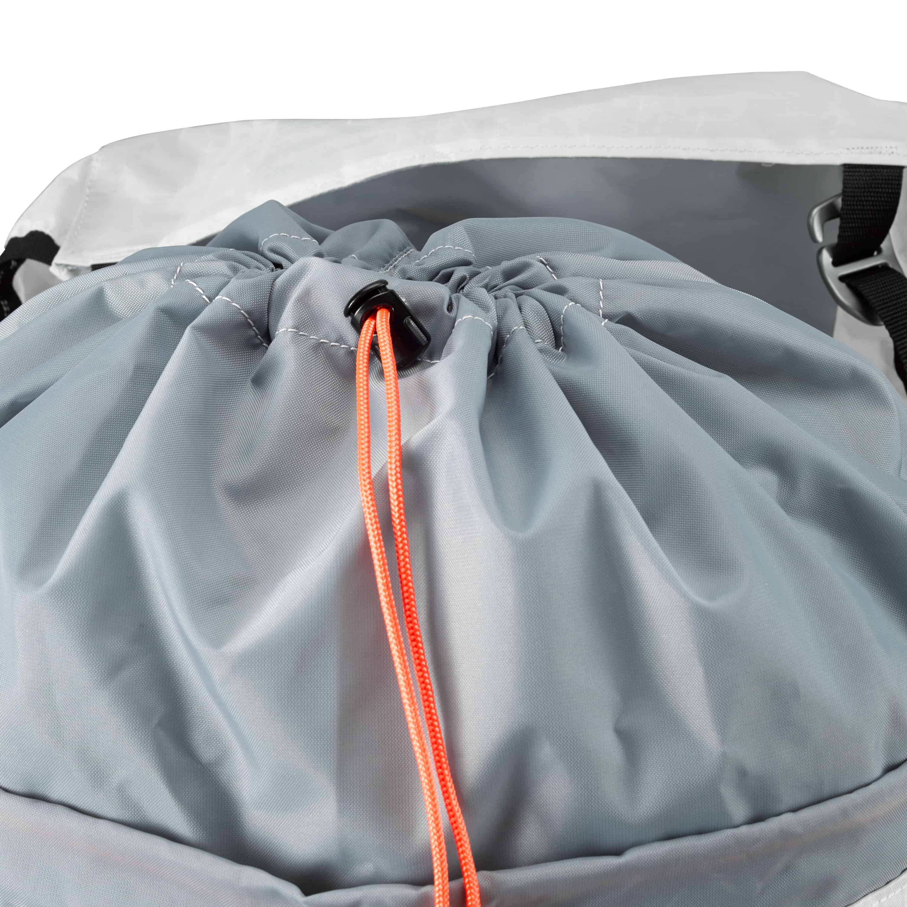 Detail shot of the drawstring closure system with extendable collar and cinch cord on Hyperlite Mountain Gear's Prism 40 Pack in White