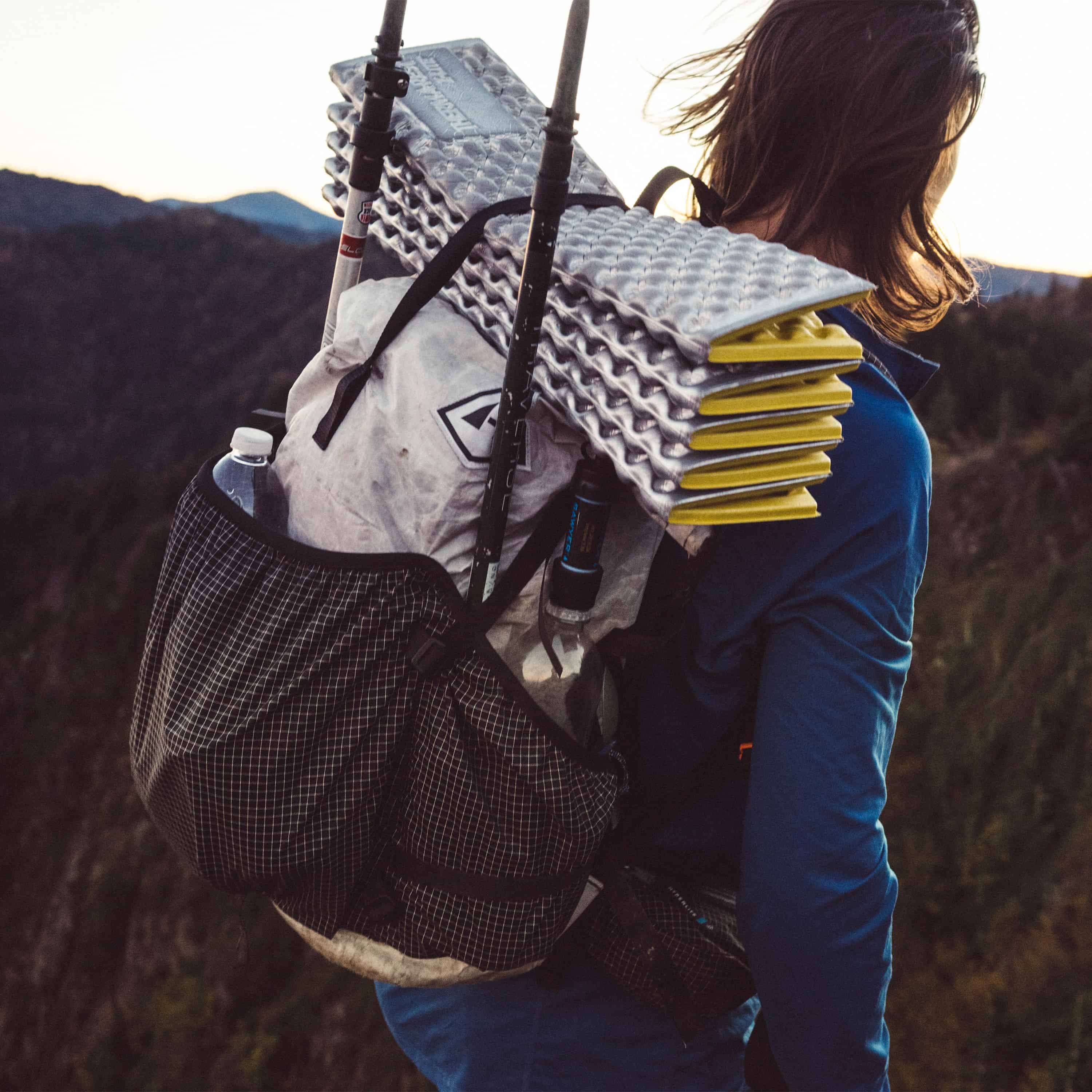 Individual carrying various items in the Southwest 40 backpack by Hyperlite Mountain Gear