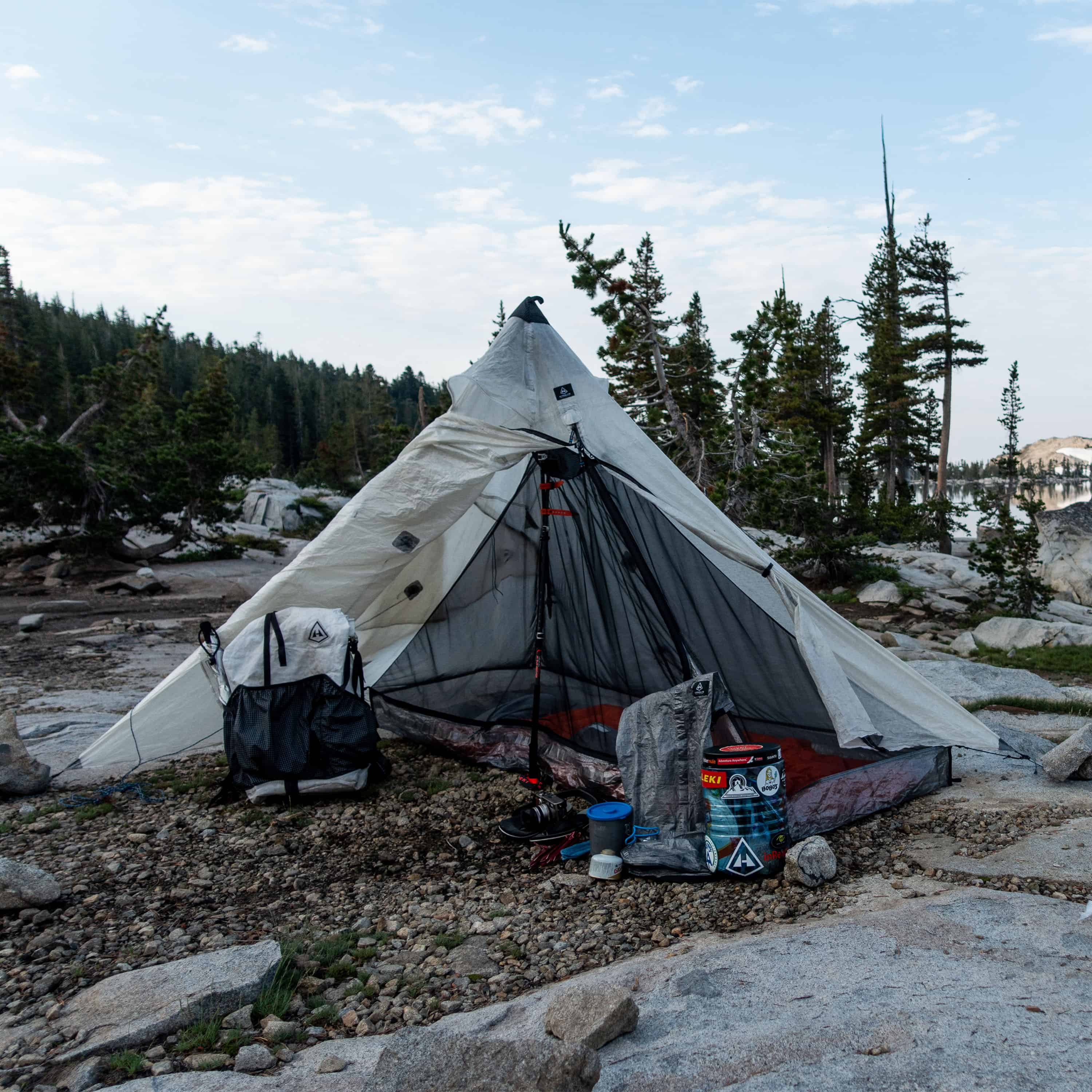 Front exterior view of Hyperlite Mountain Gear Shelters UltaMid 2 Half Insert inside white tent in a mountain setting