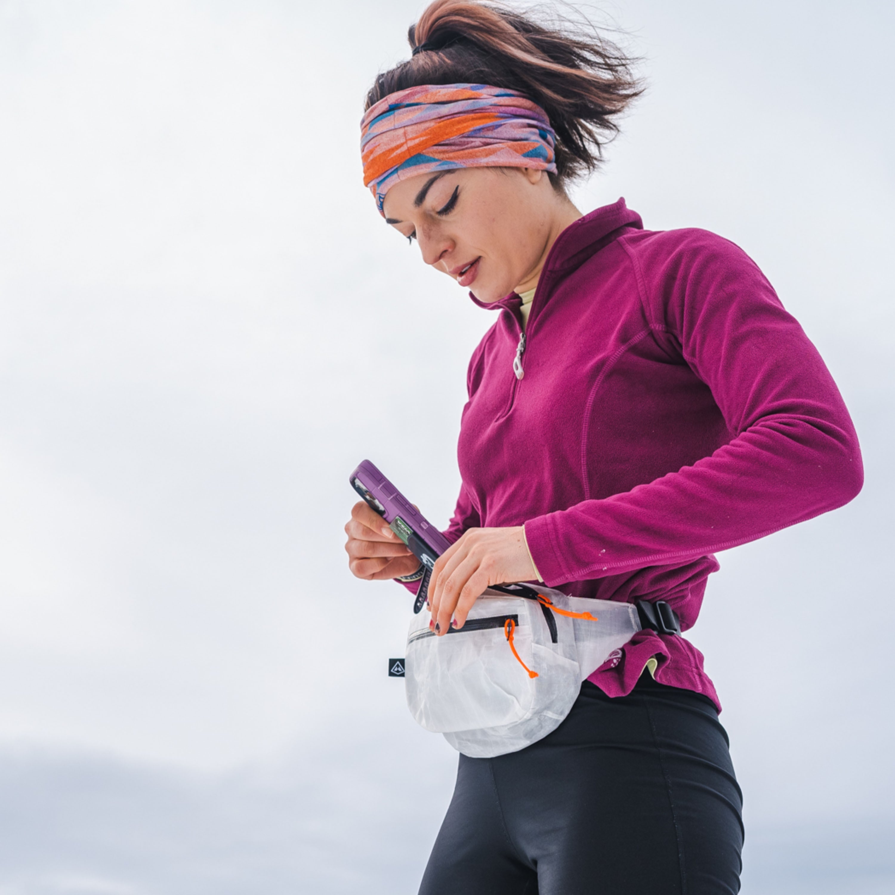 Hiker with Hyperlite Mountain Gear's Versa in White around waist