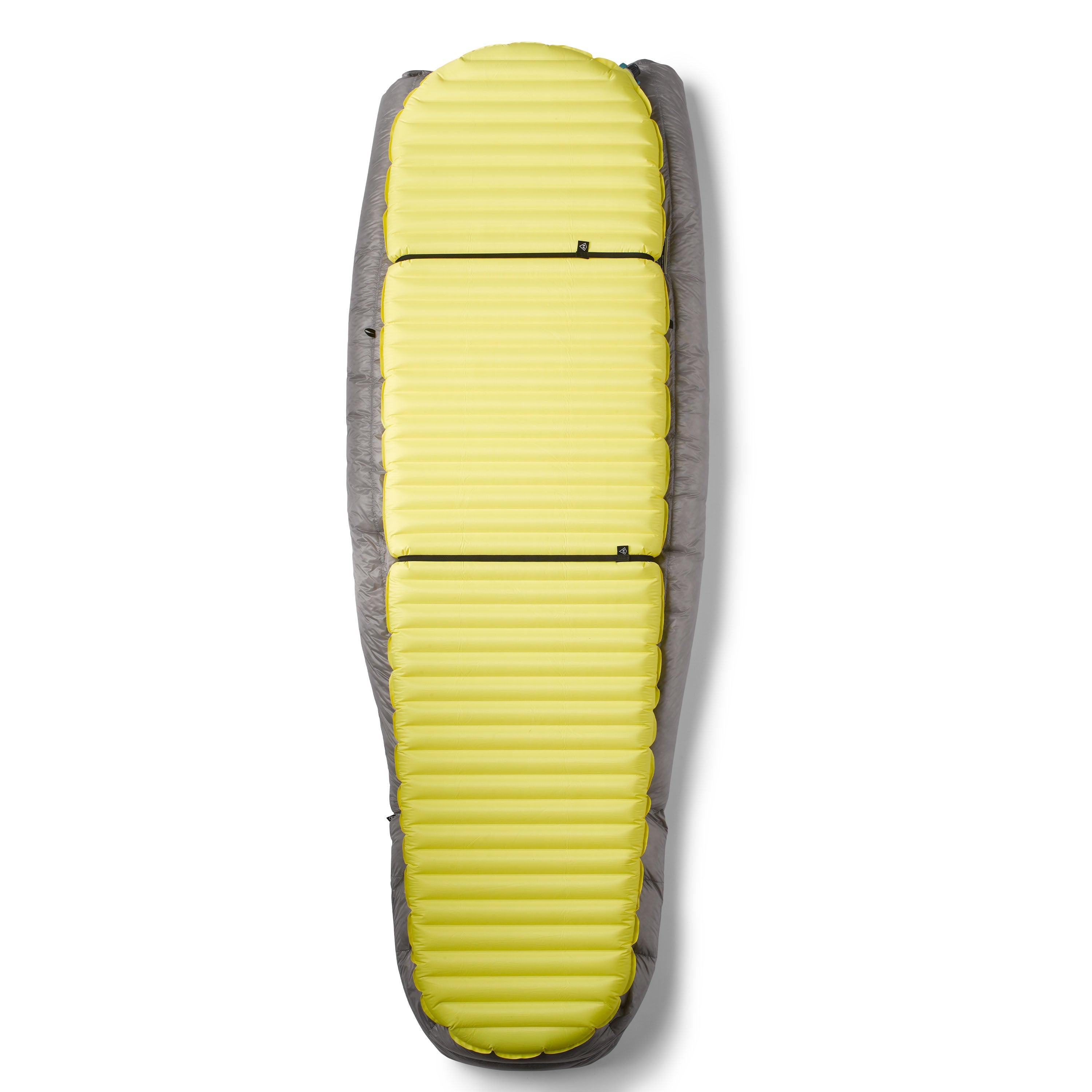 Underside view of the Hyperlite Mountain Gear 20 Degree Quilt showing it attached to a sleeping bad