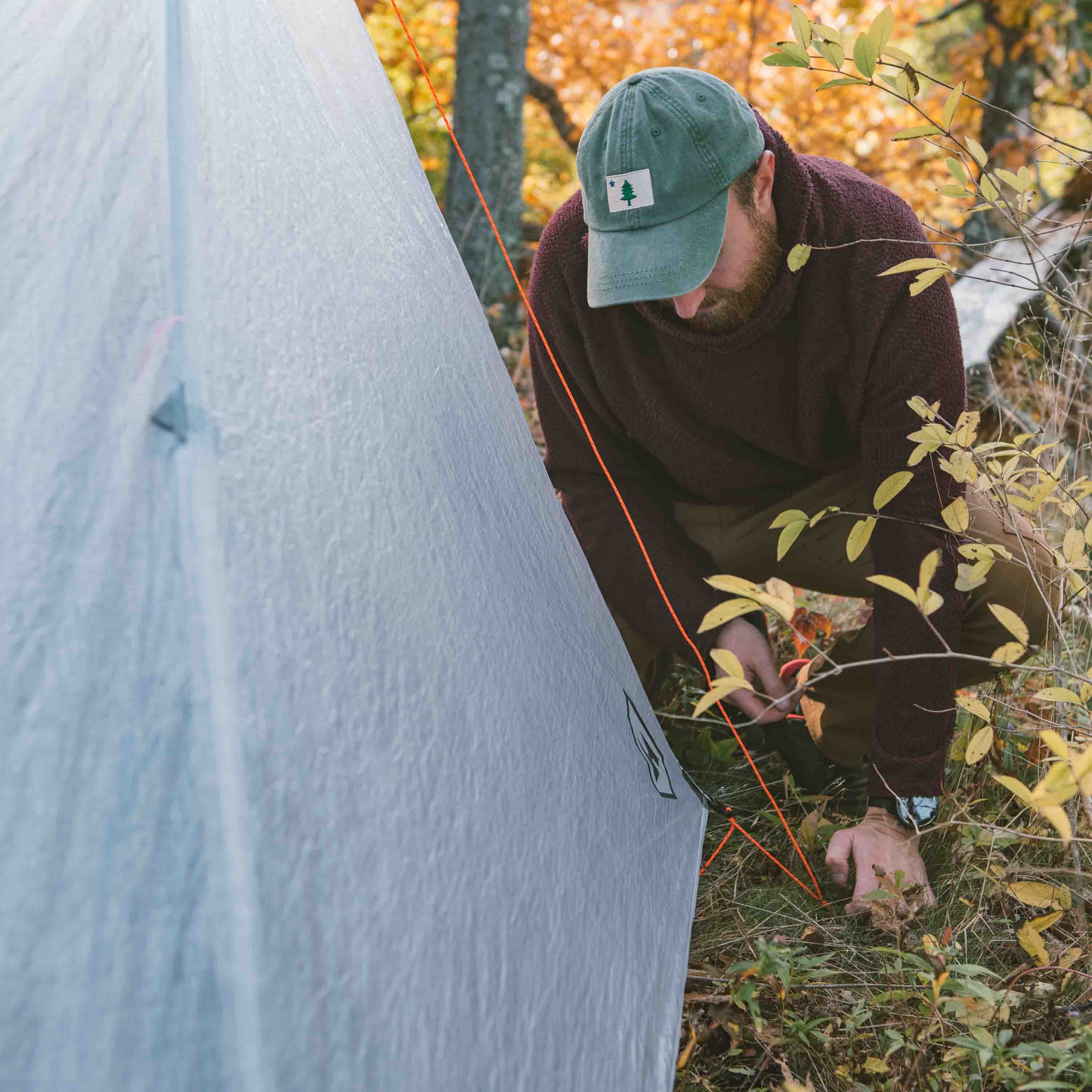 Hyperlite Mountain Gear Unbound 2P Tent tie outs being used by a camper